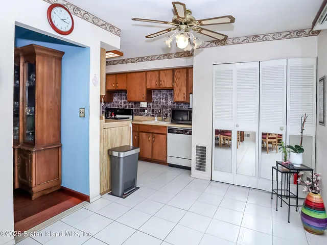 a kitchen with stainless steel appliances a stove a refrigerator and cabinets