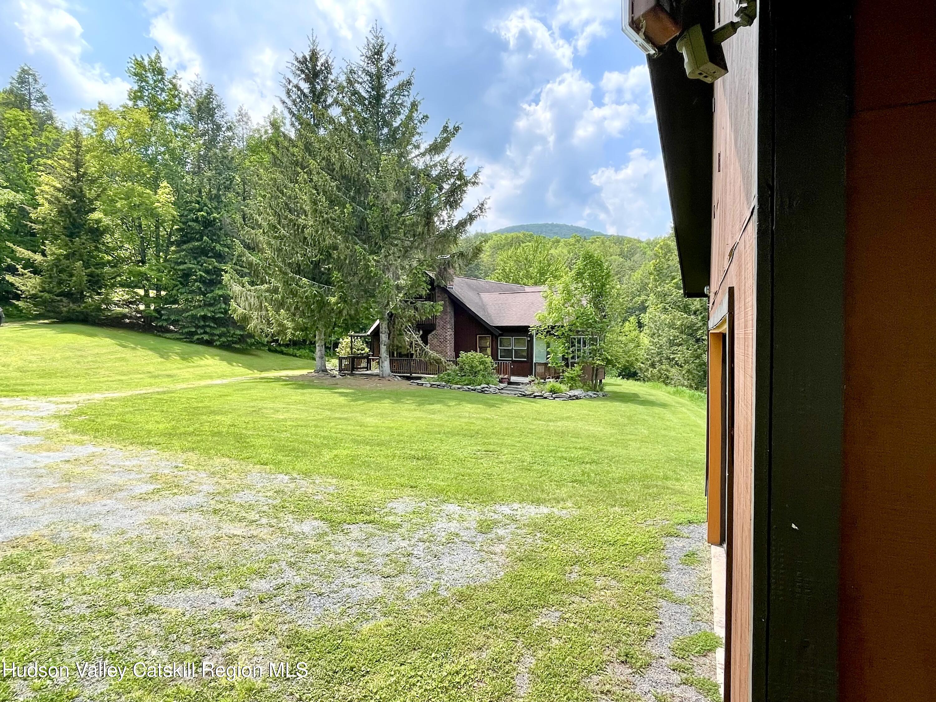 27 Terrace Drive Lexington, NY 12468 - Photo 17 of 37 a view of a backyard with table and chairs and potted plants