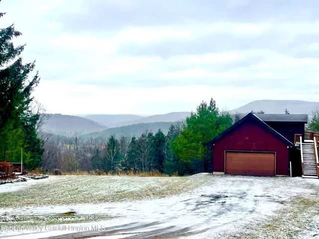 a view of a house with swimming pool