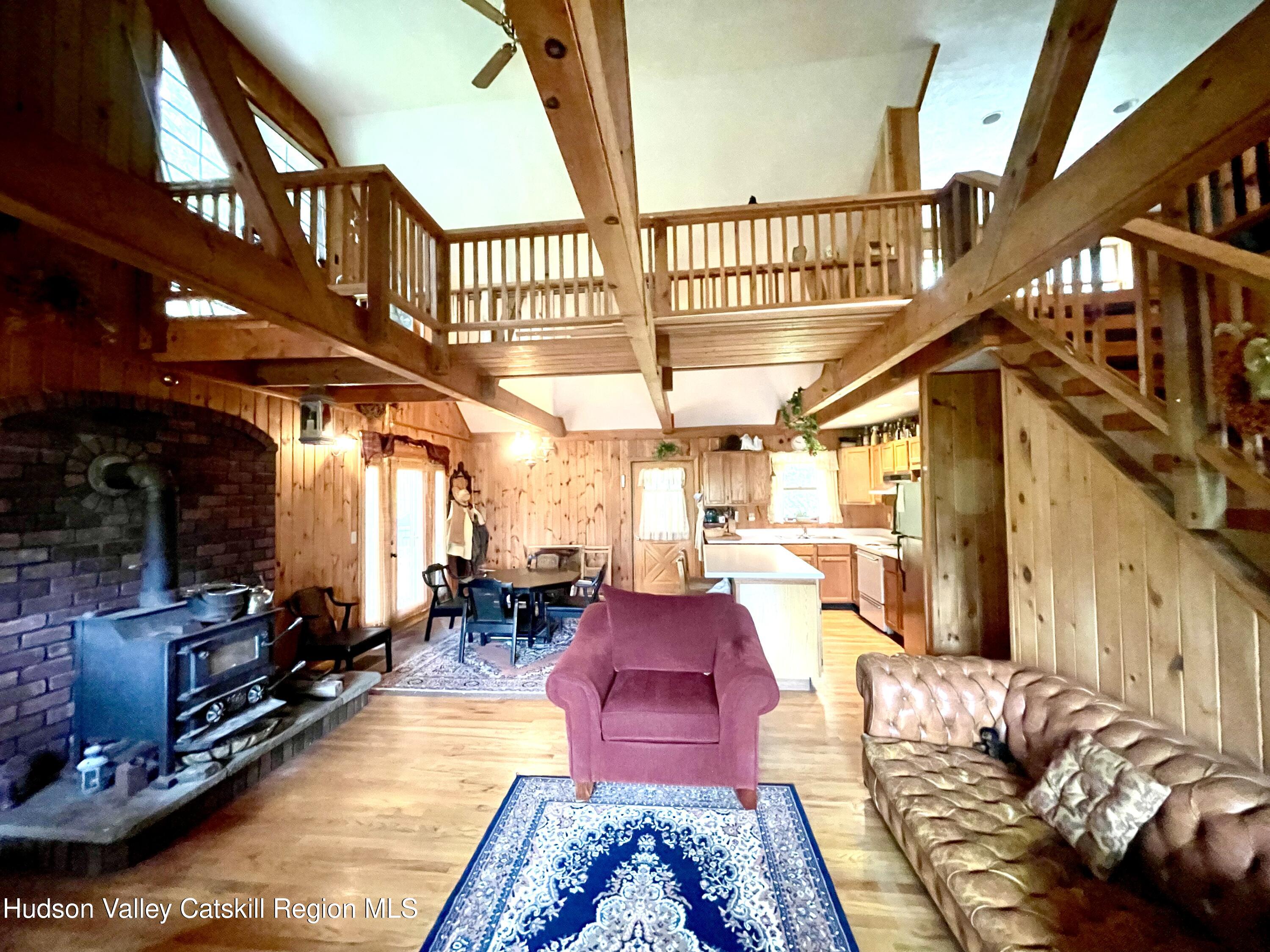27 Terrace Drive Lexington, NY 12468 - Photo 22 of 37 a living room with lots of furniture and a rug