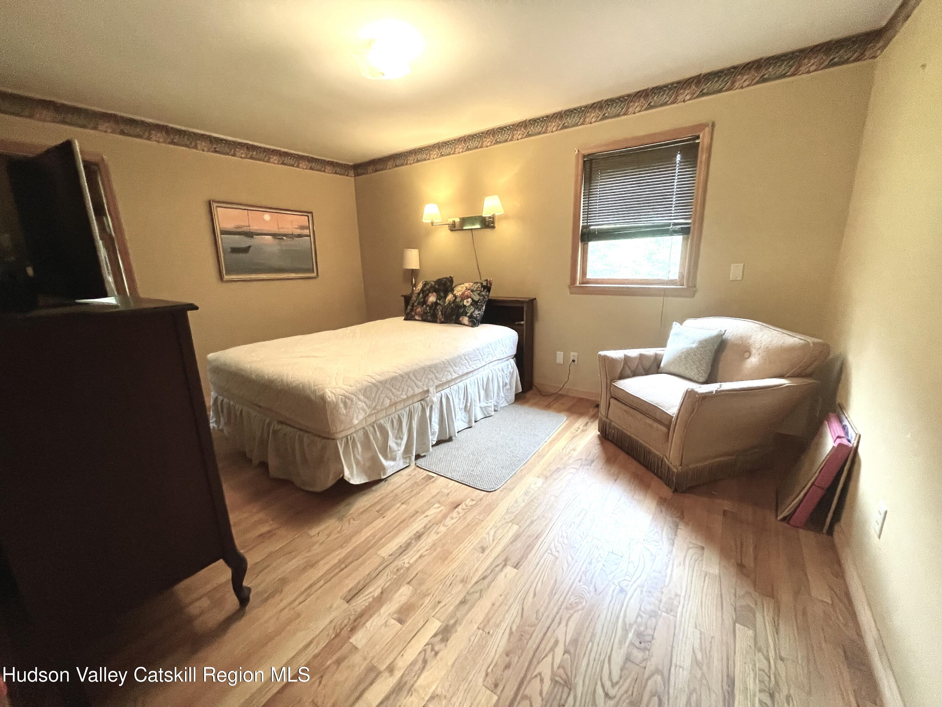 27 Terrace Drive Lexington, NY 12468 - Photo 26 of 37 a spacious bedroom with a bed and a couch