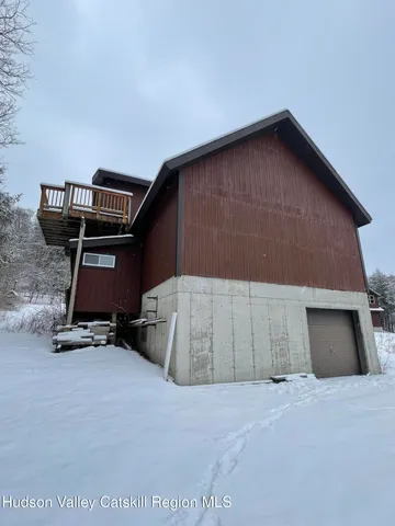 a view of a balcony with wooden floor