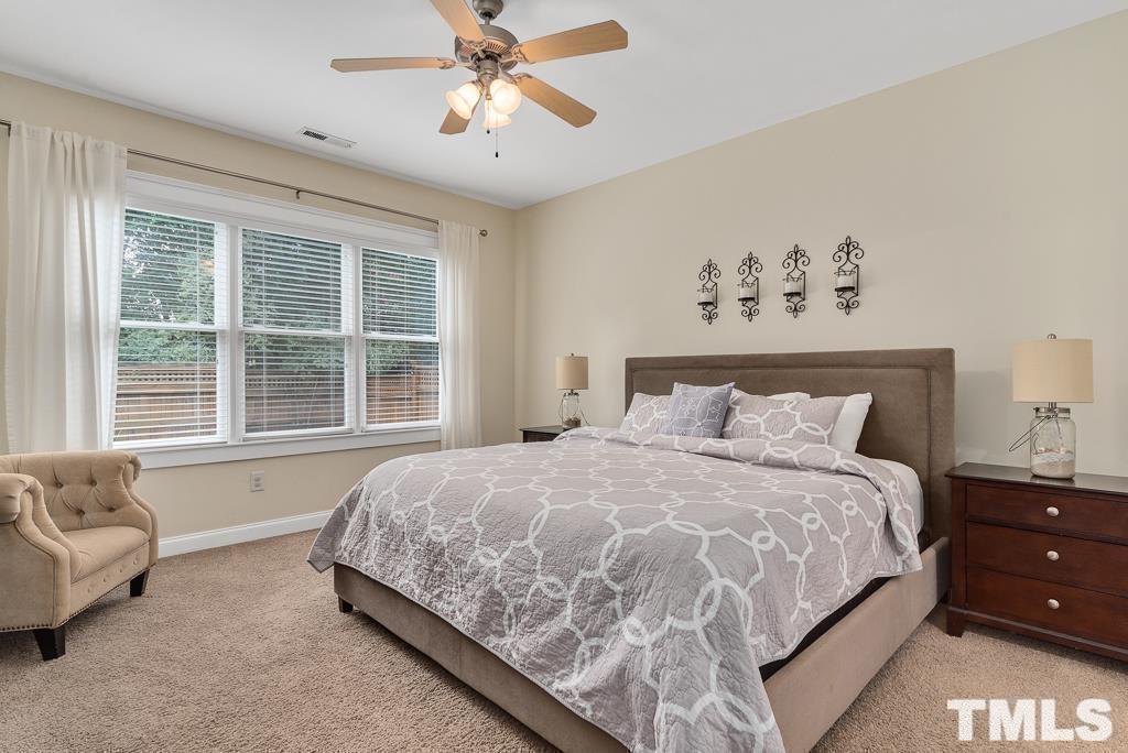 216 Frontgate Drive Cary, NC 27519 - Photo 15 of 26 a bedroom with a large bed and a window