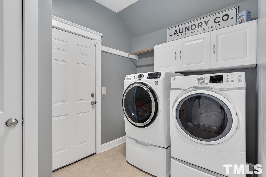216 Frontgate Drive Cary, NC 27519 - Photo 18 of 26 a utility room with dryer and washer