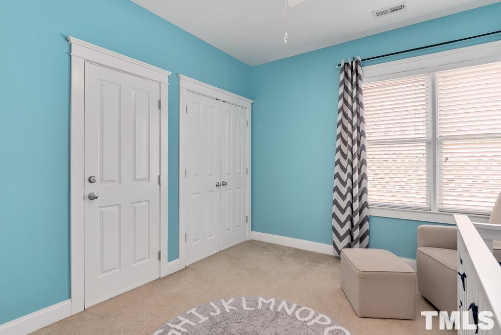 216 Frontgate Drive Cary, NC 27519 - Photo 20 of 26 a living room with furniture and a window