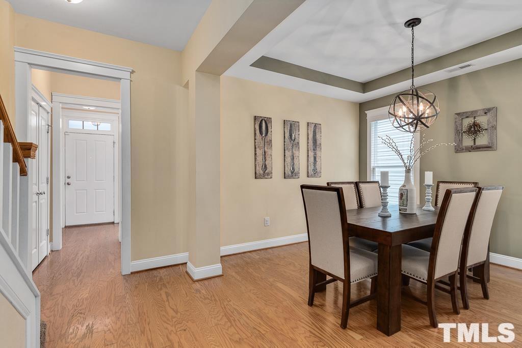 216 Frontgate Drive Cary, NC 27519 - Photo 5 of 26 a dining room with furniture window and wooden floor