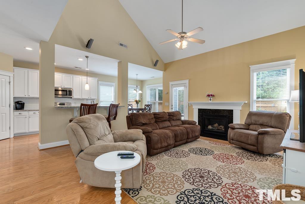 216 Frontgate Drive Cary, NC 27519 - Photo 7 of 26 a living room with furniture and a fireplace