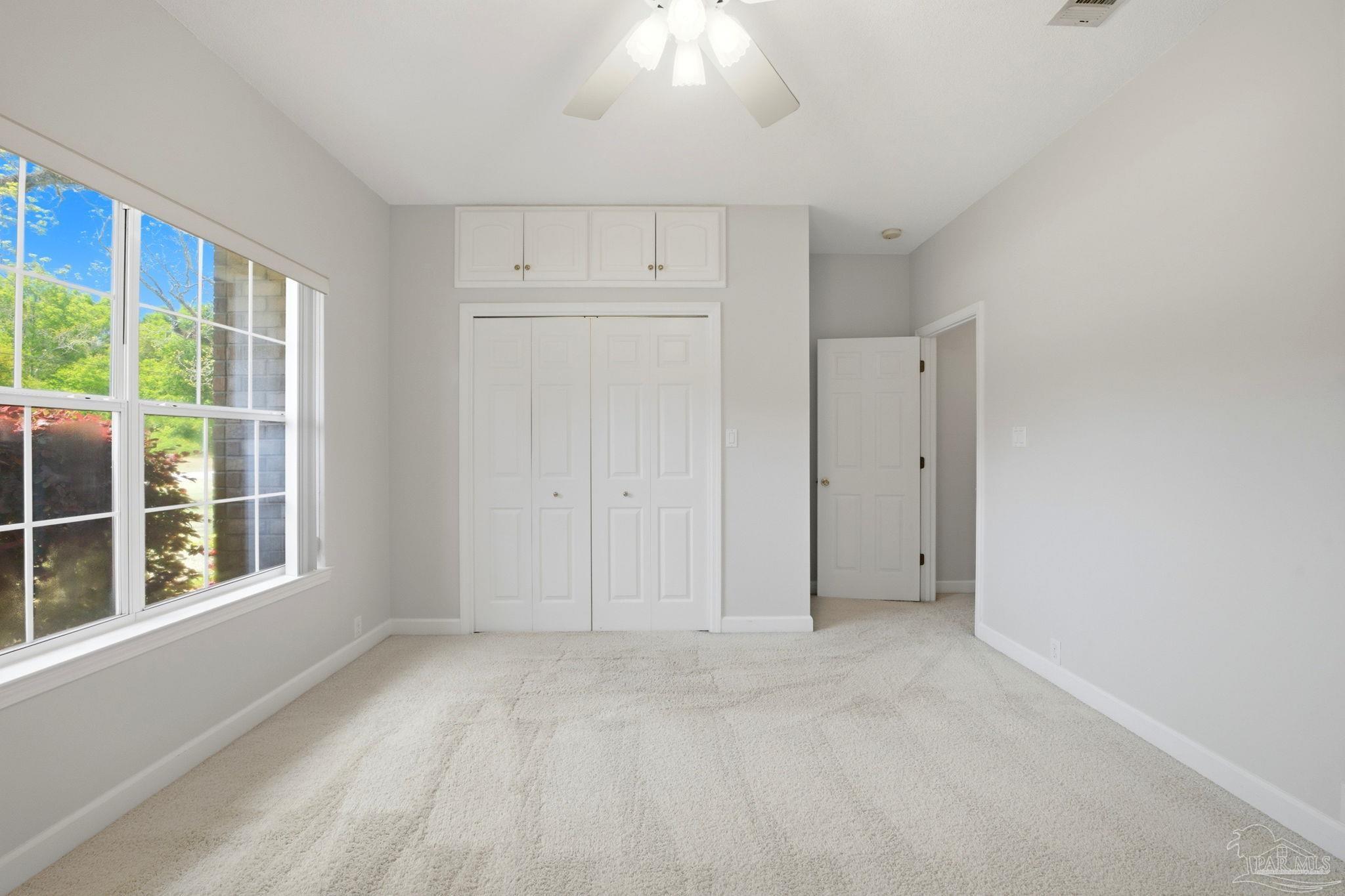 4552 Peaden Road Pace, FL 32571 - Photo 31 of 38 a view of an empty room with a window