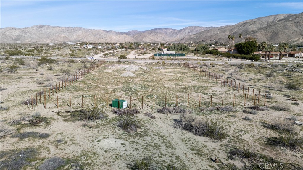 65 Dillon Road Desert Hot Springs, CA 92241 - Photo 13 of 24 a view of a dry field with mountains in the background