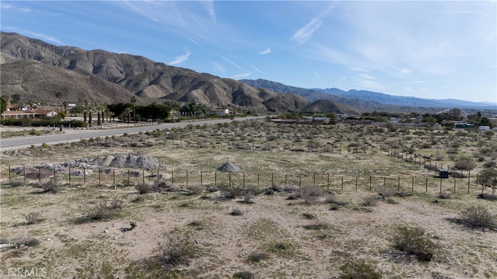 65 Dillon Road Desert Hot Springs, CA 92241 - Photo 10 of 24 a view of a dry yard with mountains and mountain view