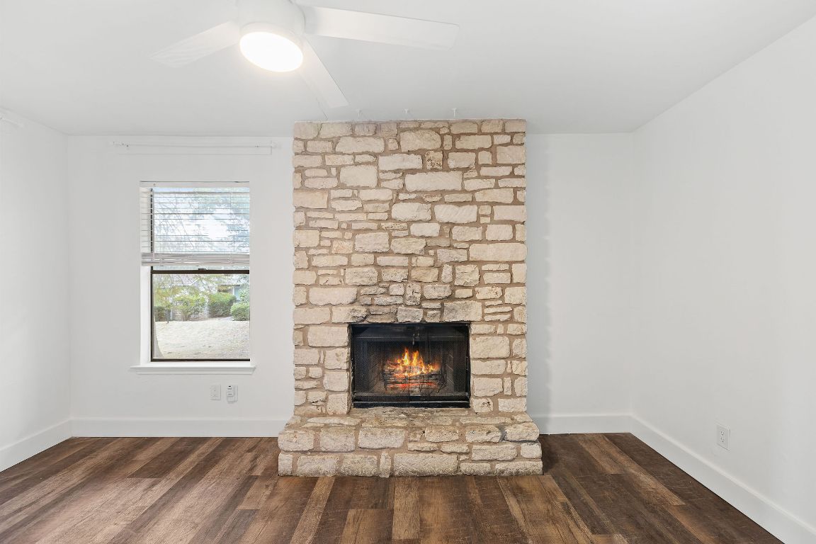 1712 Timber Ridge Road Austin, TX 78741 - Photo 17 of 35 a room with a fireplace