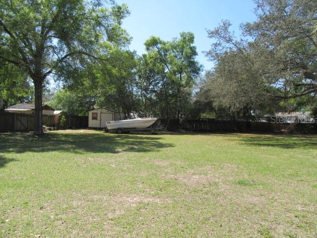 Southeast 102nd Court Road Summerfield, FL 34491 - Photo 9 of 10 a swimming pool with wooden fence