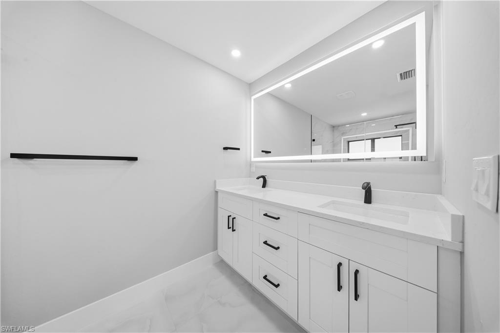3406 25th Street Southwest Lehigh Acres, FL 33976 - Photo 25 of 44 MASTER BATHROOM bath with SHOWER, light marble finish floors, double vanity, and recessed lighting