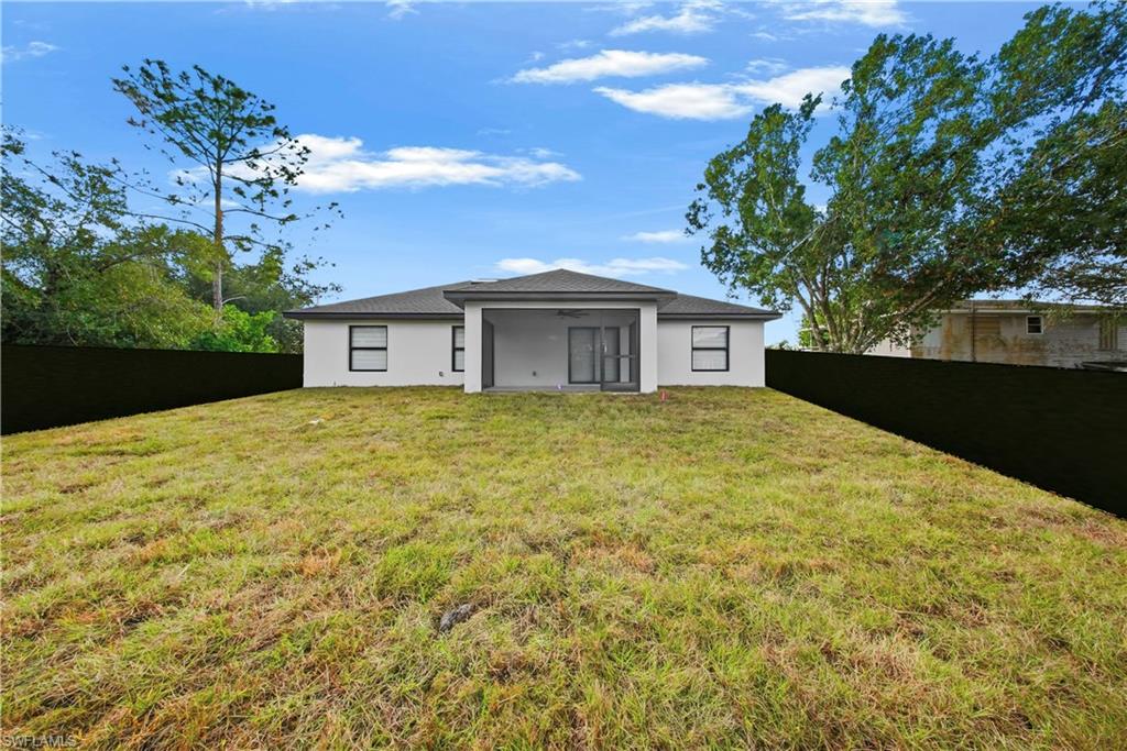 3406 25th Street Southwest Lehigh Acres, FL 33976 - Photo 31 of 44 a view of a house with a garden