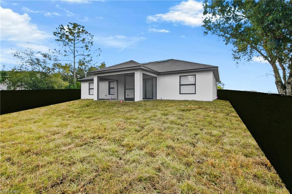 3406 25th Street Southwest Lehigh Acres, FL 33976 - Photo 32 of 44 a view of a house with a yard and potted plants
