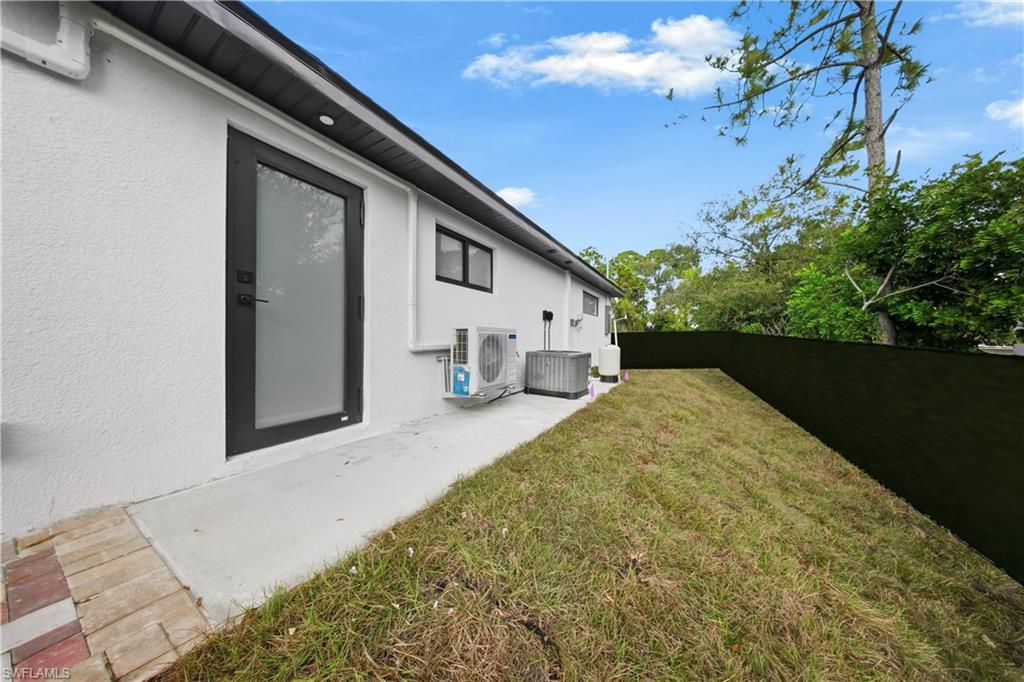 3406 25th Street Southwest Lehigh Acres, FL 33976 - Photo 34 of 44 a house view with a backyard space