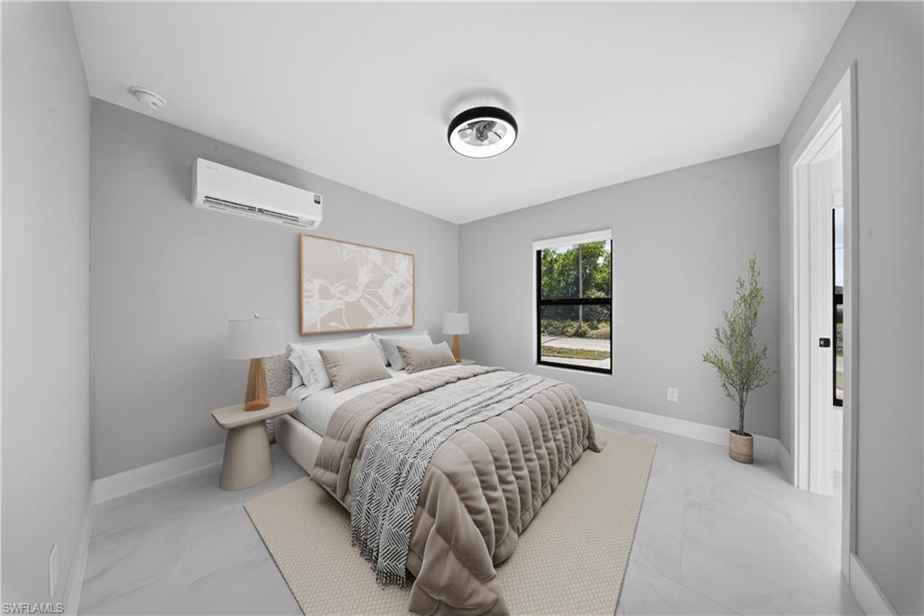 3406 25th Street Southwest Lehigh Acres, FL 33976 - Photo 38 of 44 Bedroom with baseboards and a wall mounted AC