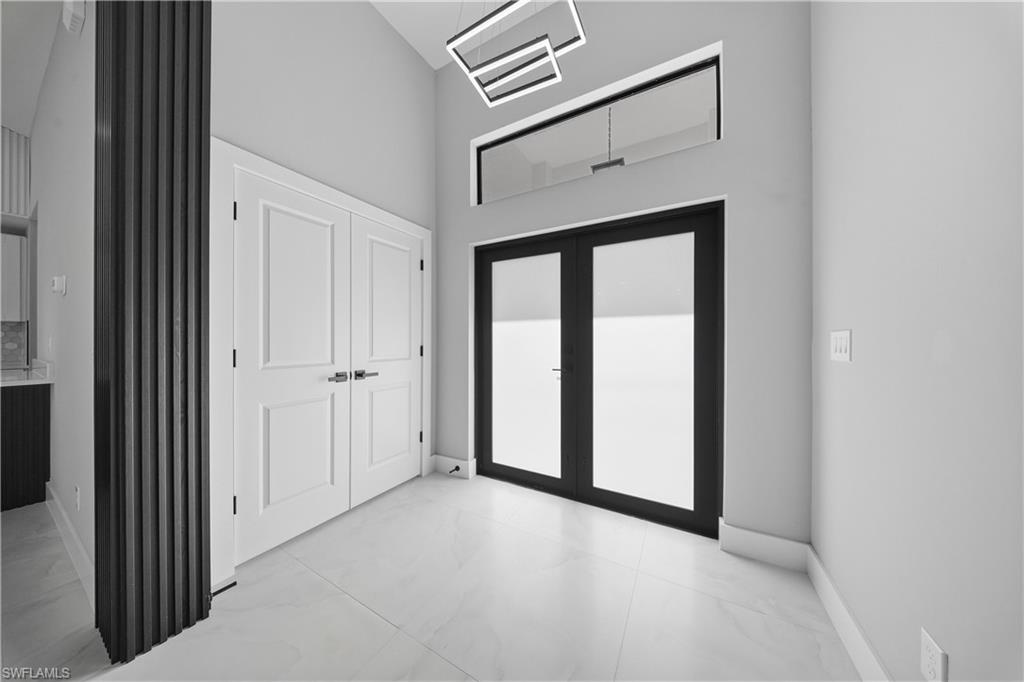 3406 25th Street Southwest Lehigh Acres, FL 33976 - Photo 4 of 44 a view of a livingroom with an entryway