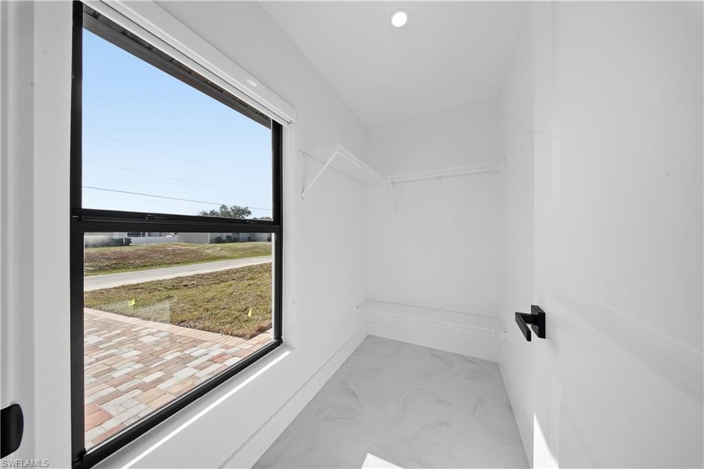 3406 25th Street Southwest Lehigh Acres, FL 33976 - Photo 40 of 44 Walk in closet with marble finish floors