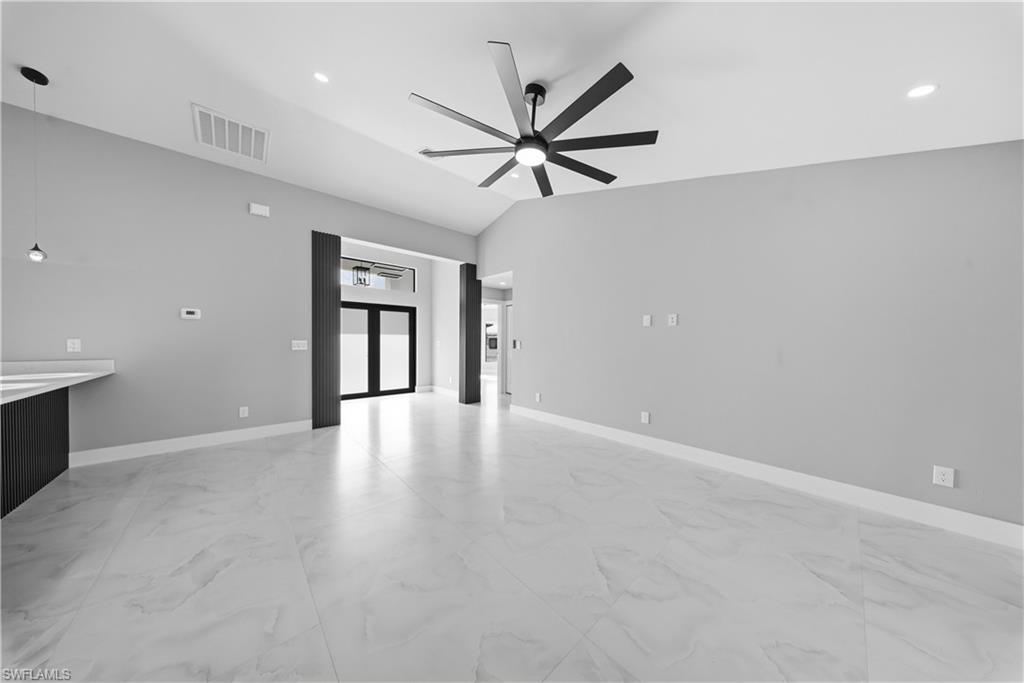 3406 25th Street Southwest Lehigh Acres, FL 33976 - Photo 6 of 44 an empty room with fan and windows
