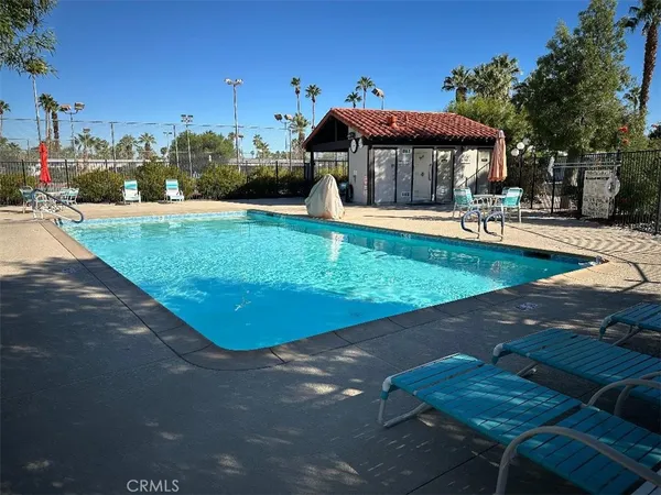 a view of a patio with swimming pool