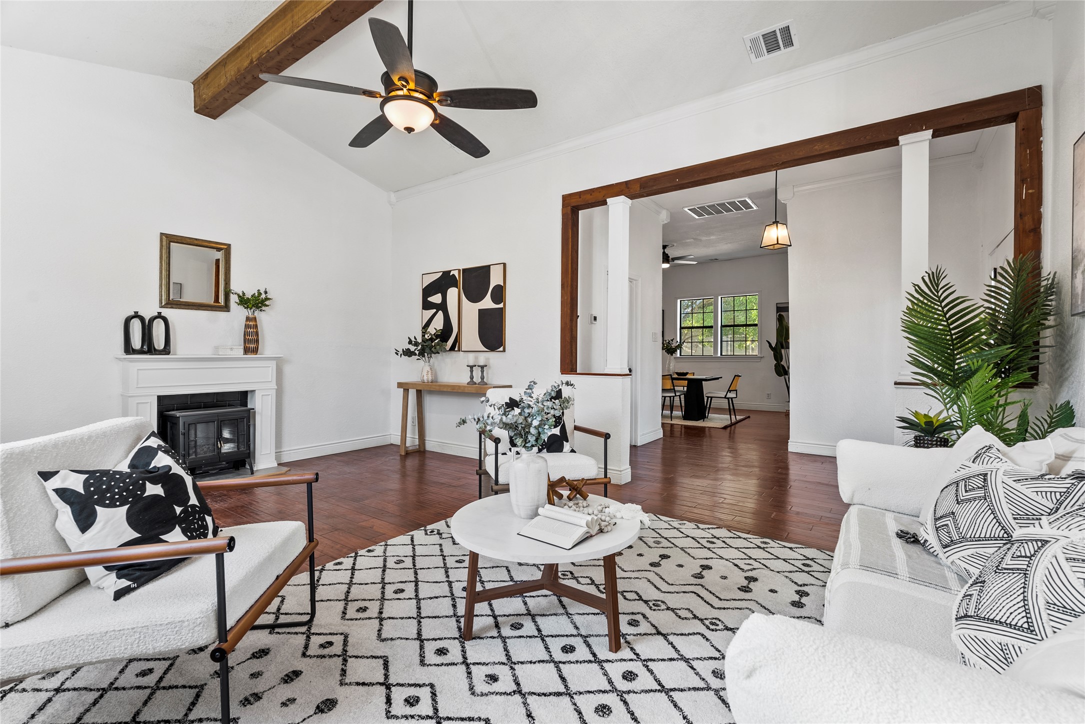 a living room with furniture and a fireplace