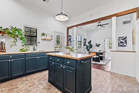 a spacious bathroom with a granite countertop sink a mirror and a