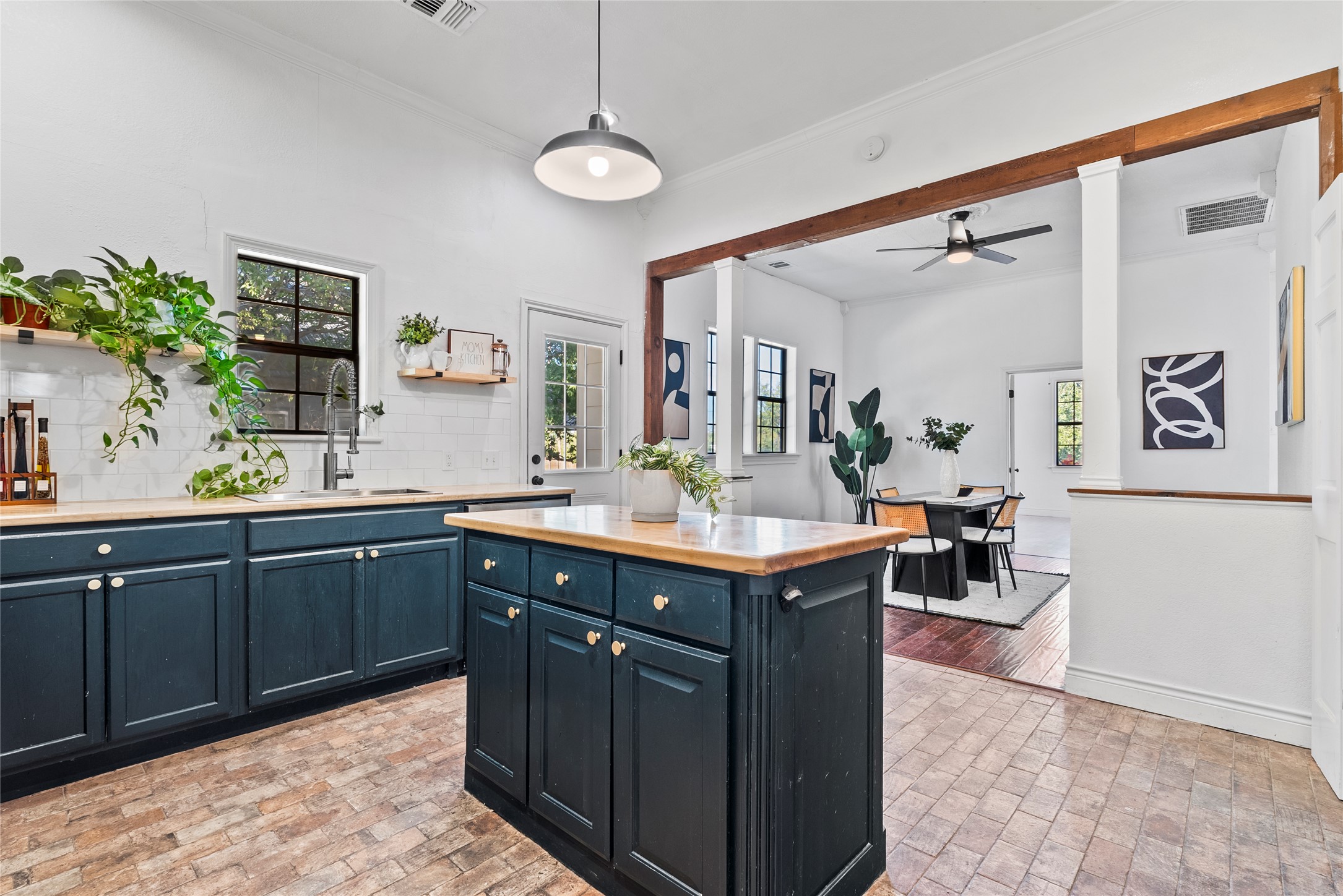 1011 Porter Street Taylor, TX 76574 - Photo 13 of 35 Easily transition from the dining to the renovated kitchen. This makes hosting easy!