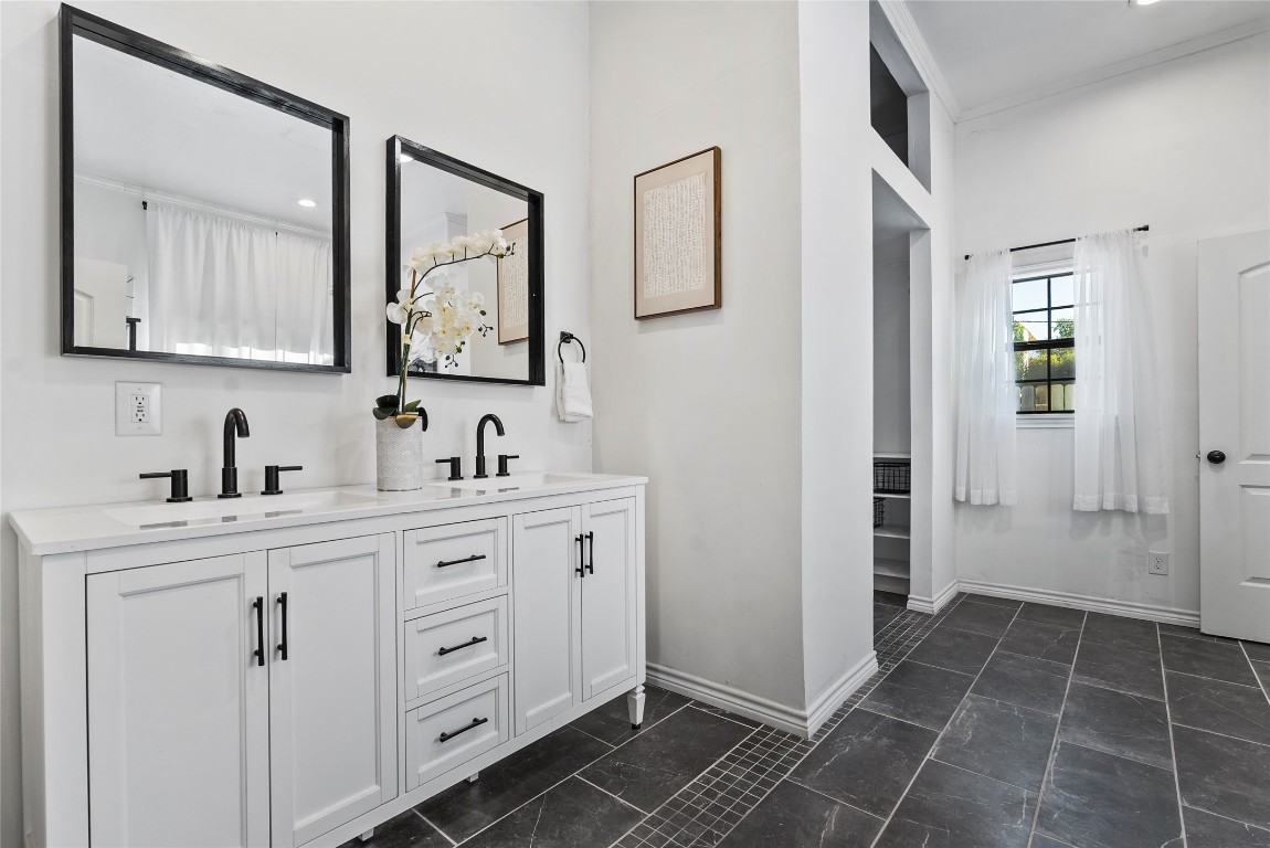 1011 Porter Street Taylor, TX 76574 - Photo 20 of 35 a spacious bathroom with a double vanity sink mirror and