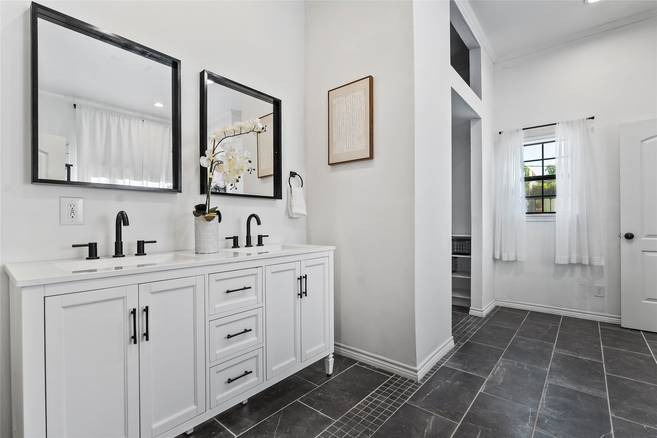 1011 Porter Street Taylor, TX 76574 - Photo 20 of 35 a spacious bathroom with a double vanity sink mirror and