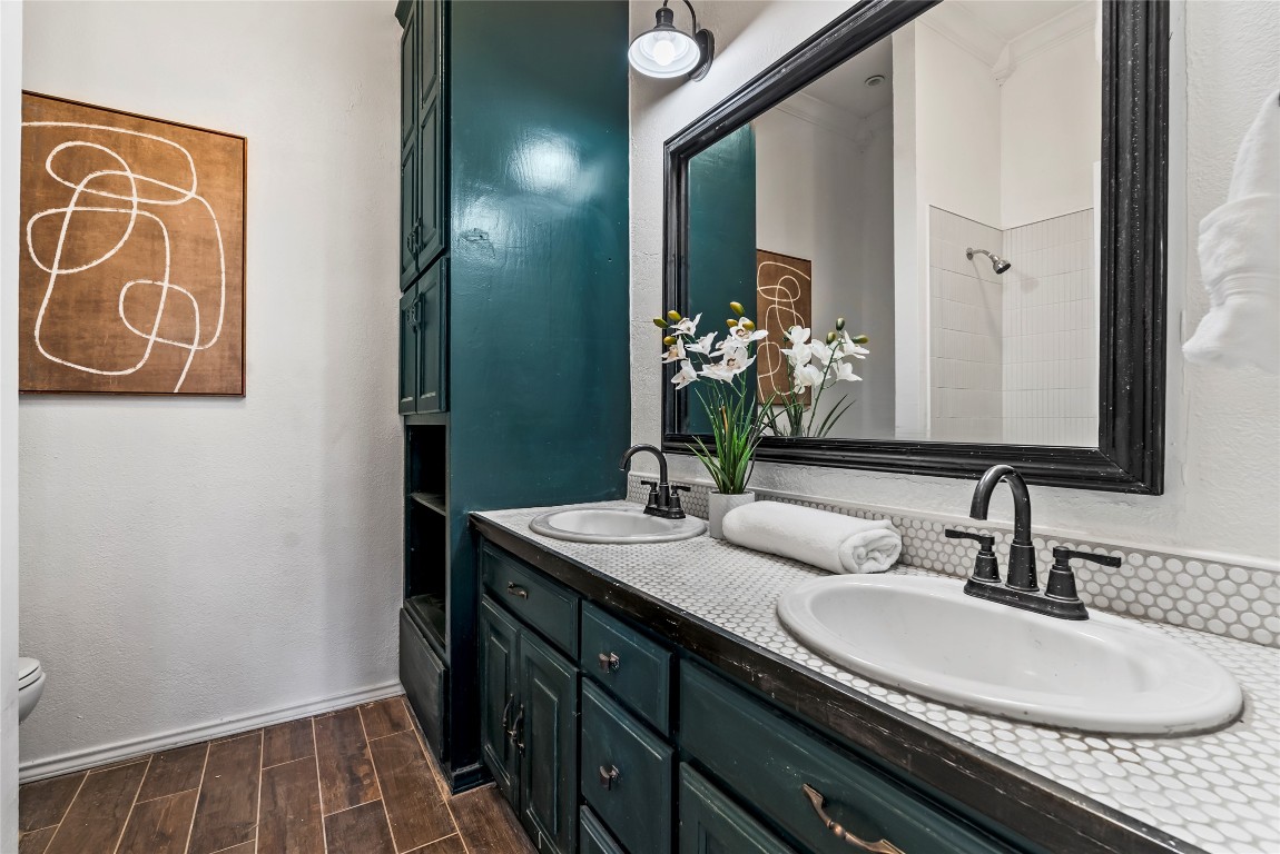 1011 Porter Street Taylor, TX 76574 - Photo 24 of 35 a bathroom with a sink and a mirror