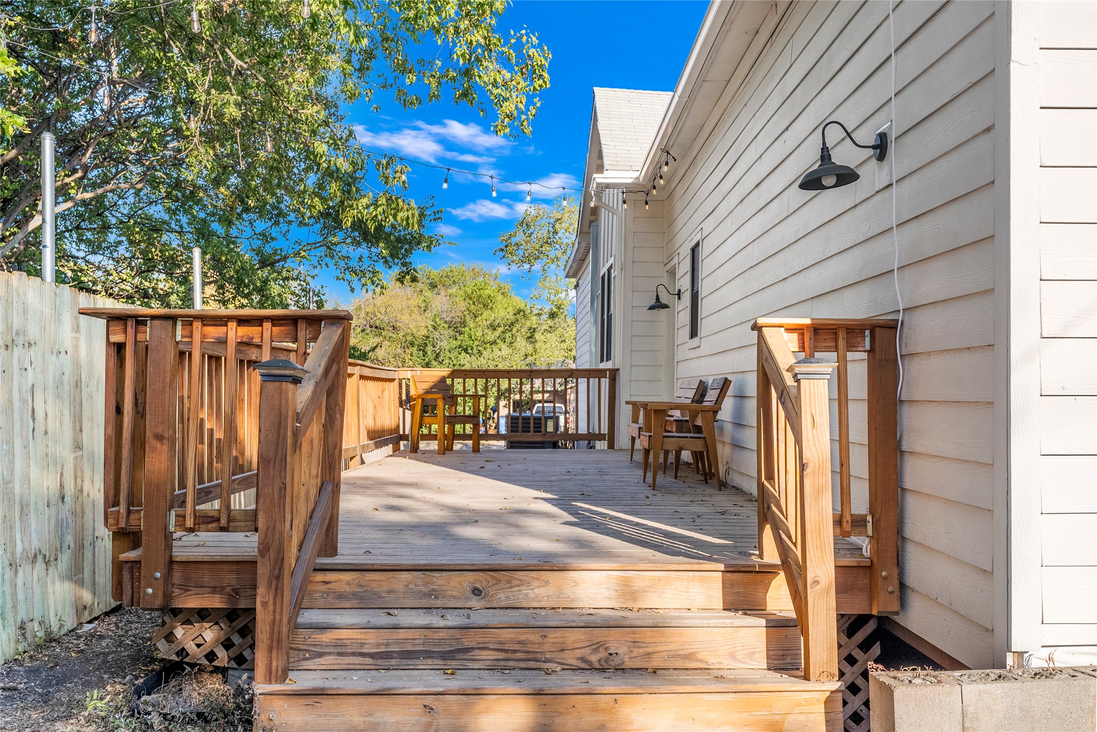 1011 Porter Street Taylor, TX 76574 - Photo 26 of 35 a view of a patio with table and chairs and wooden fence