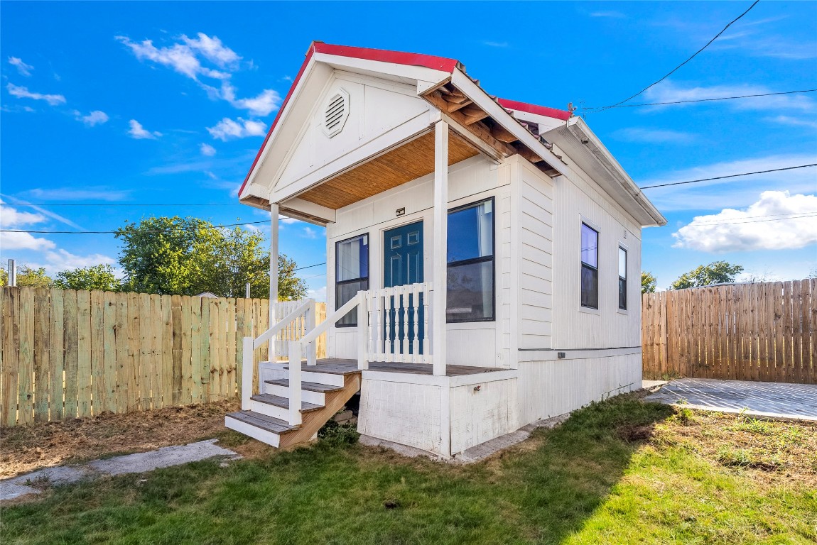 1011 Porter Street Taylor, TX 76574 - Photo 27 of 35 a view of a house with a small yard and wooden fence