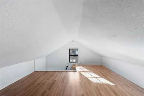 an aerial view of a house with swimming pool and outdoor seating