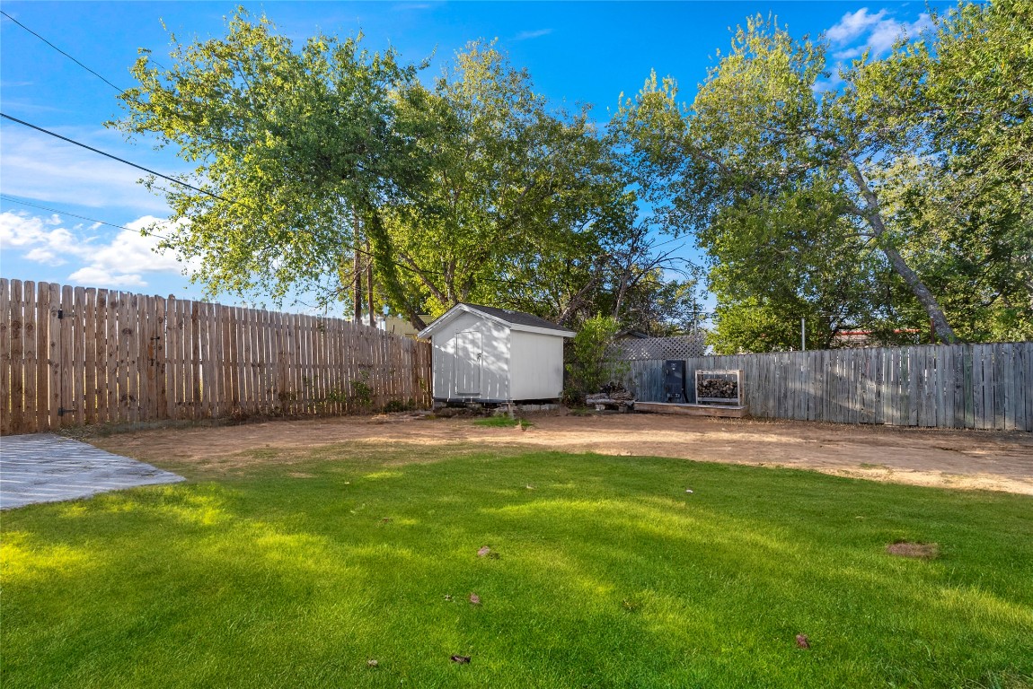 1011 Porter Street Taylor, TX 76574 - Photo 33 of 35 a backyard of a house with table and chairs