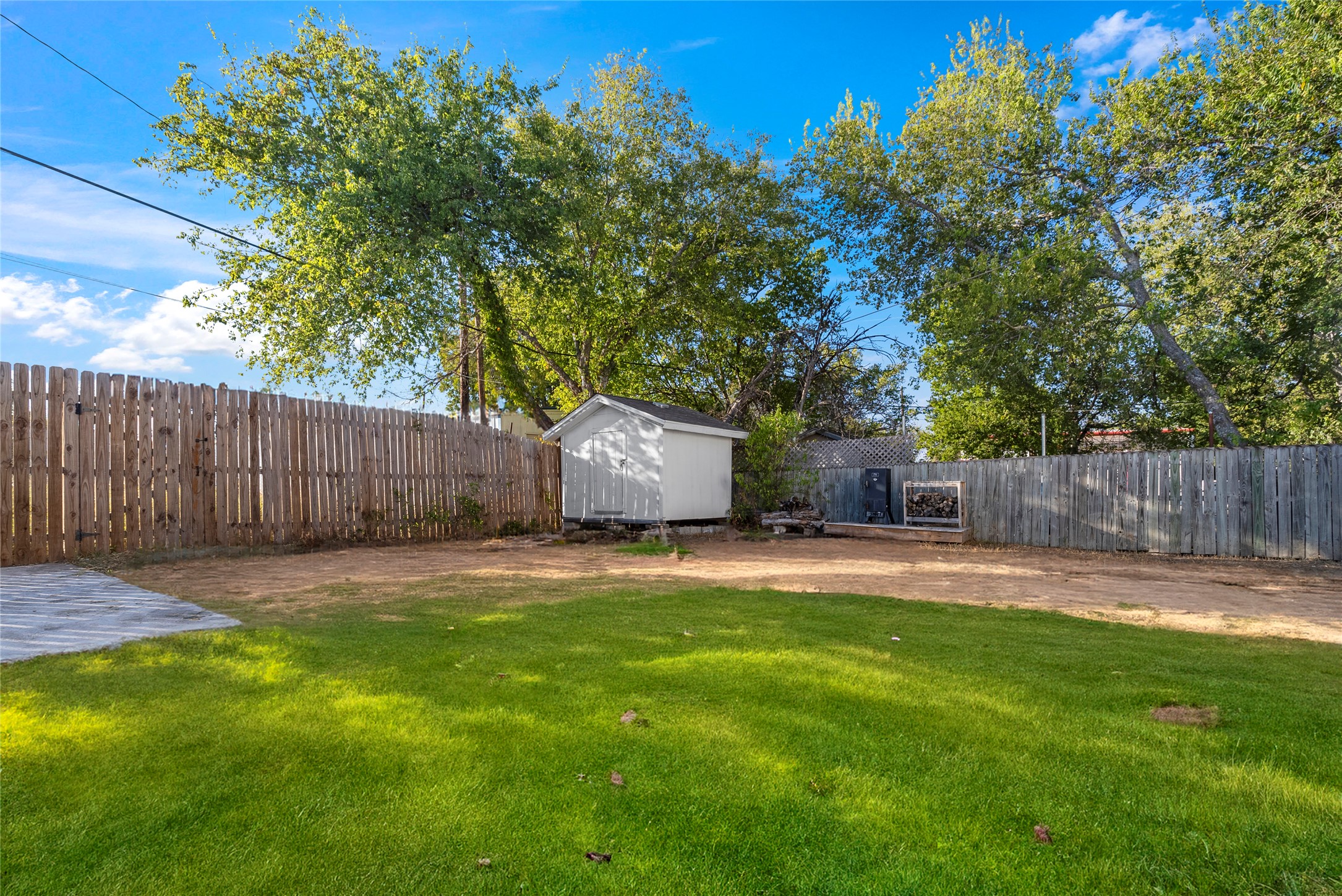 1011 Porter Street Taylor, TX 76574 - Photo 33 of 35 a backyard of a house with table and chairs