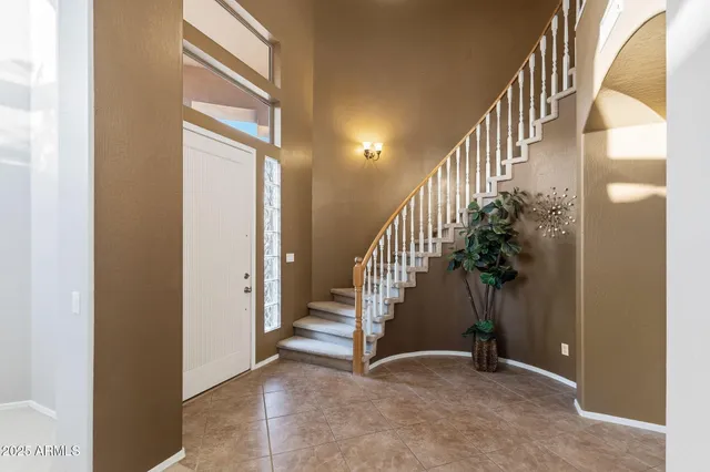 a room with pool table and windows