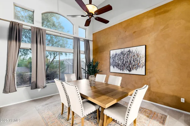 a large kitchen with a table and chairs in it