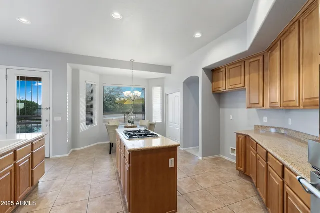 a view of a house with swimming pool and sitting area