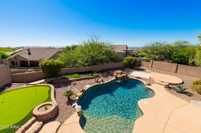 an aerial view of a swimming pool patio and outdoor seating