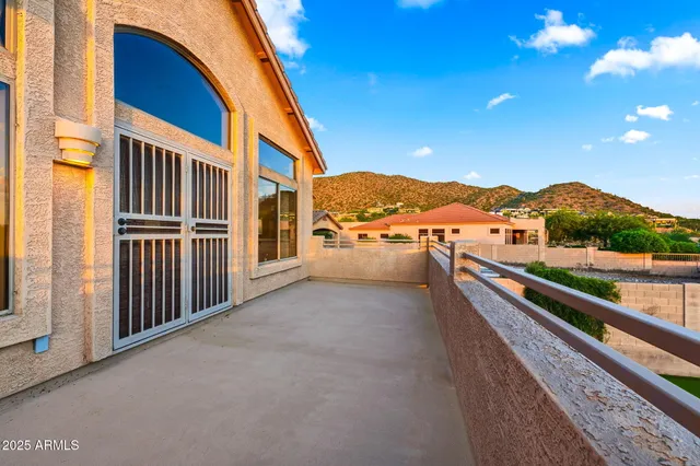 a view of balcony with furniture