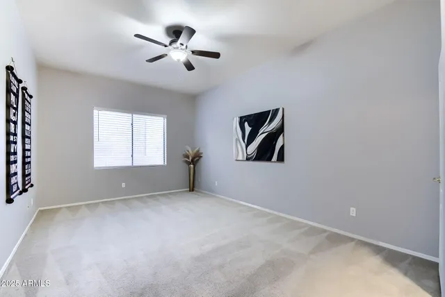 a living room with furniture a fireplace and a dining table