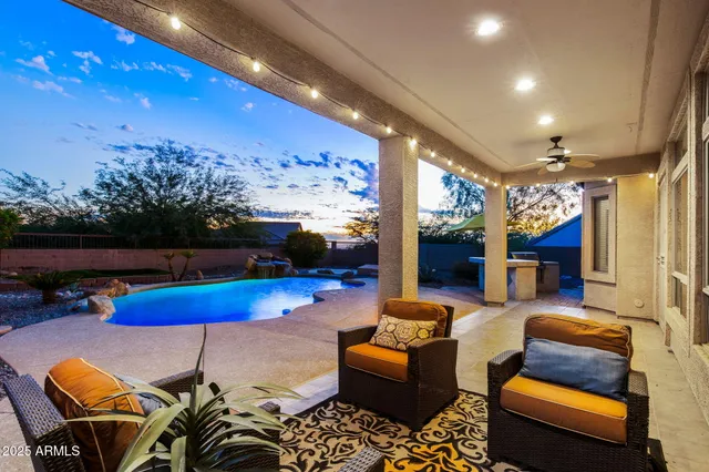 a living room with furniture a rug and a fireplace