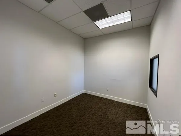 an empty room with a bench