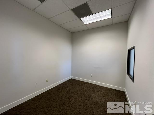 140 West Huffaker Lane, Unit 506 506 Reno, NV 89511 - Photo 4 of 15 an empty room with a bench