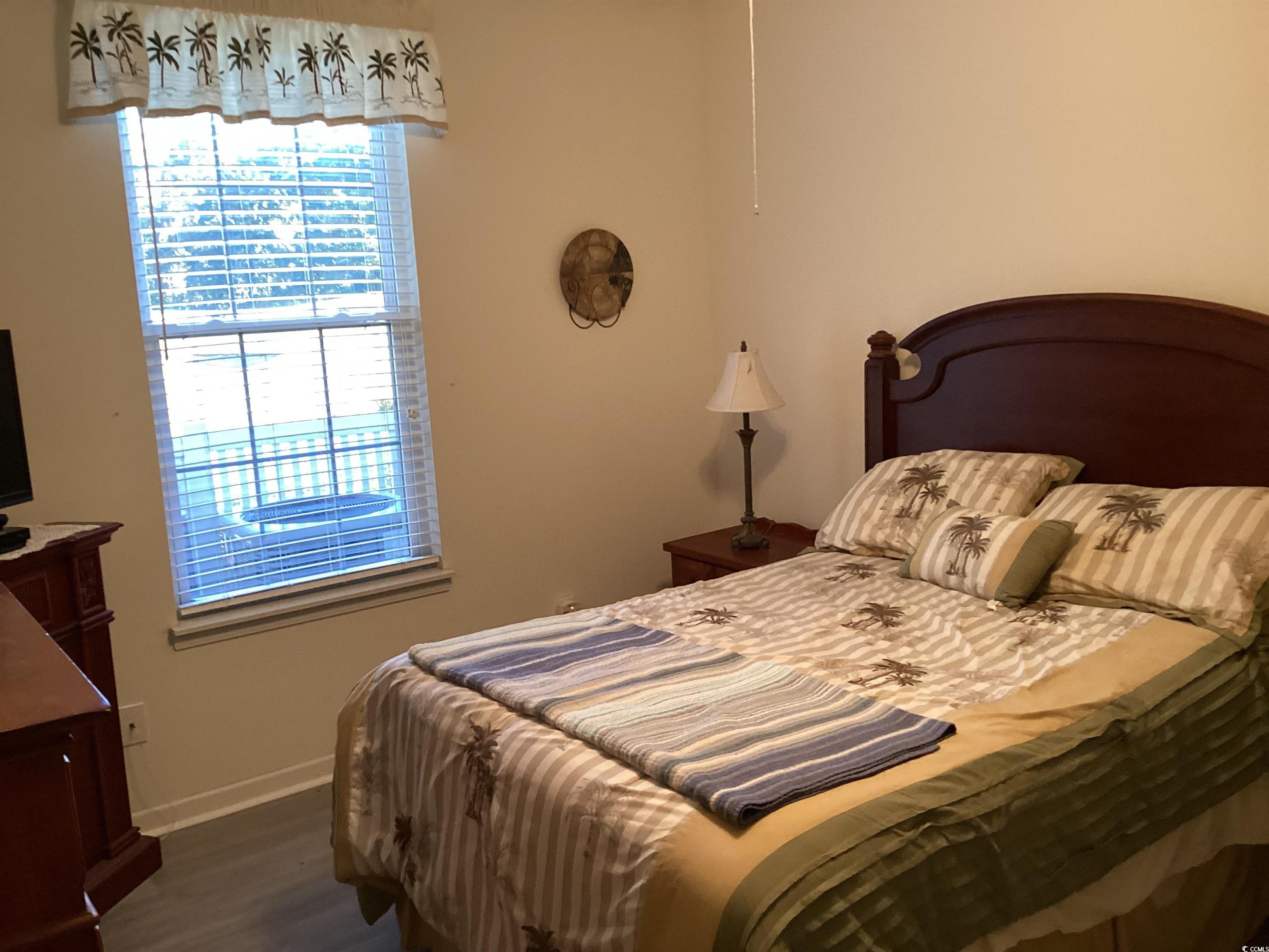 4430 Lady Banks Lane, Unit C1 Murrells Inlet, SC 29576 - Photo 20 of 34 Bedroom with baseboards and dark wood finished floors