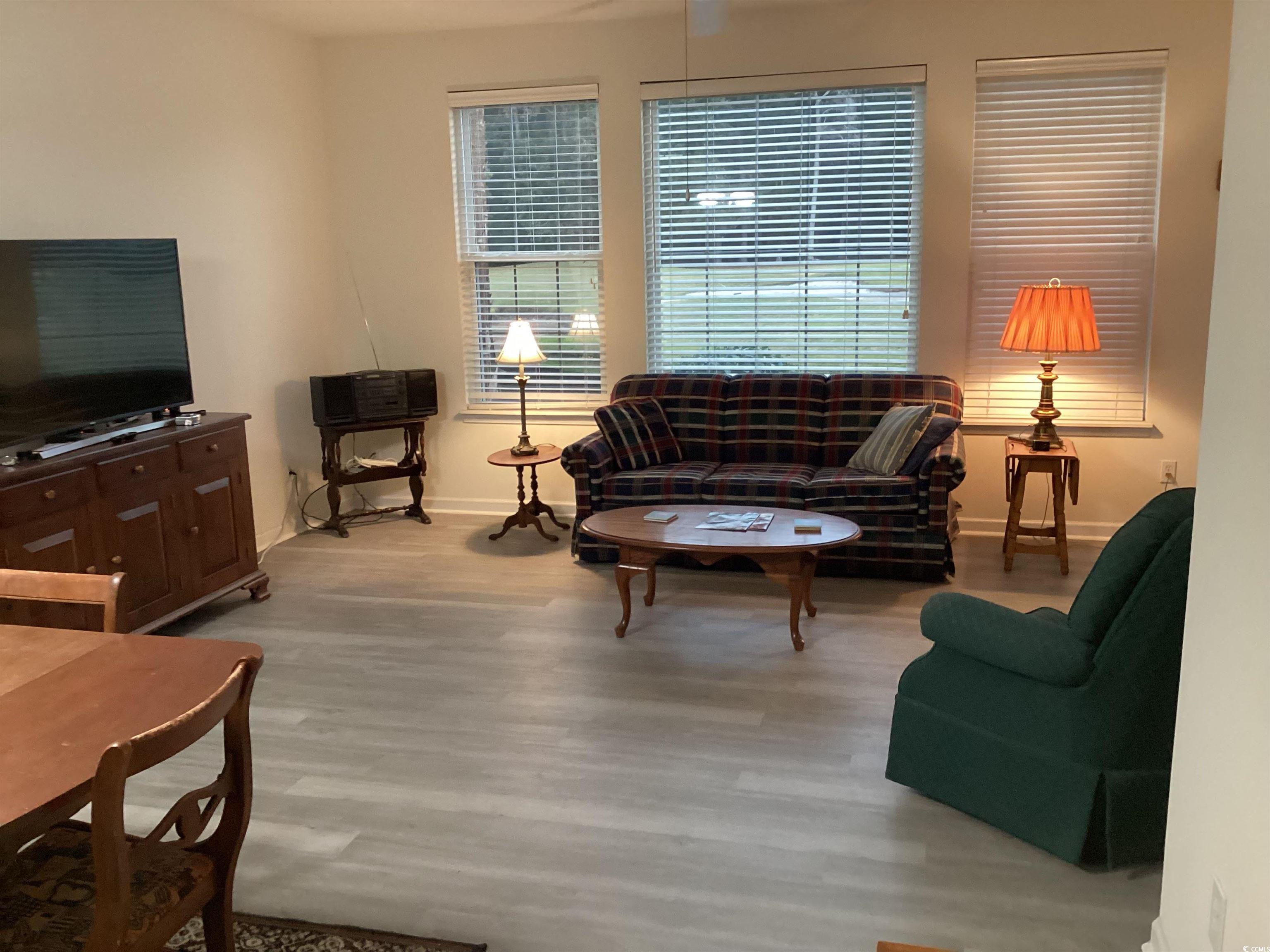 4430 Lady Banks Lane, Unit C1 Murrells Inlet, SC 29576 - Photo 9 of 34 Living room featuring light wood-style flooring and baseboards