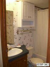 511 Maple Grove Church Road, Unit 10 Weddington, NC 28104 - Photo 3 of 7 a bathroom with a granite countertop sink a toilet and shower