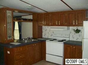 511 Maple Grove Church Road, Unit 10 Weddington, NC 28104 - Photo 5 of 7 a kitchen with a stove and a sink