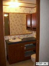 511 Maple Grove Church Road, Unit 10 Weddington, NC 28104 - Photo 7 of 7 a bathroom with a sink and a mirror